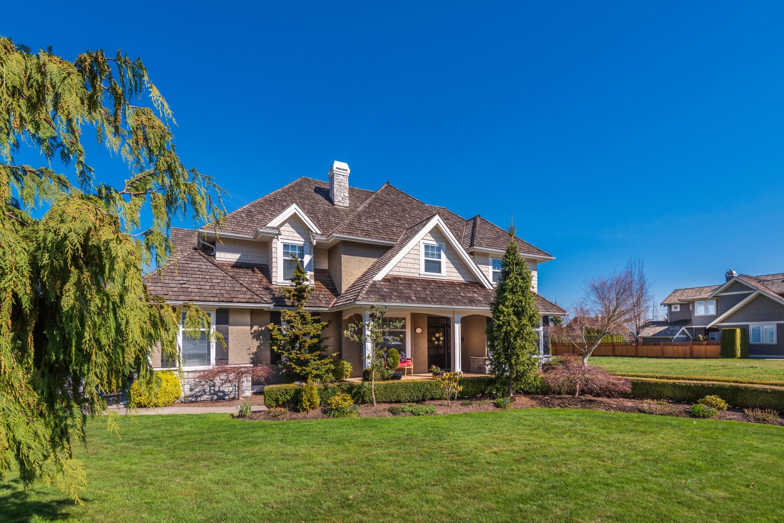 A perfect neighbourhood. Houses in suburb at Summer in the north America. Luxury houses with nice landscape.